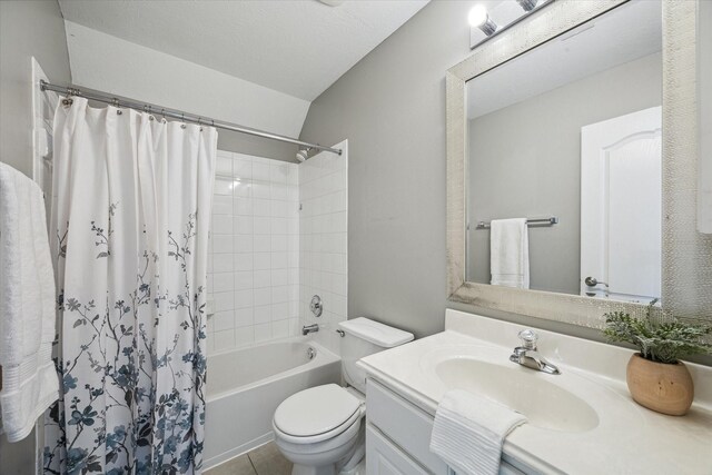 bathroom with tile patterned floors, toilet, vanity, and shower / bath combo