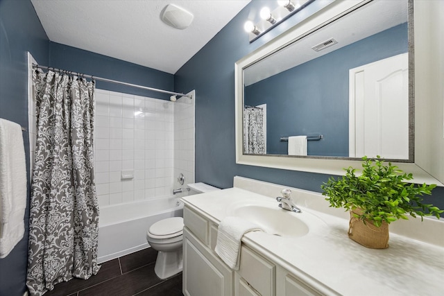 full bath with visible vents, shower / bath combo with shower curtain, toilet, wood finished floors, and vanity