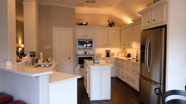 kitchen with a sink, white cabinetry, and stainless steel appliances