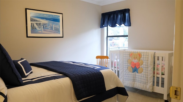 bedroom featuring carpet floors and ornamental molding