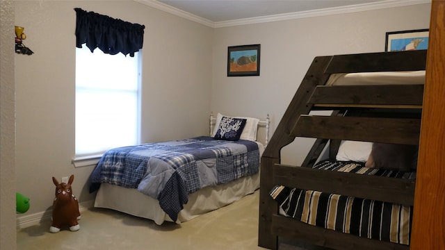 carpeted bedroom with baseboards and ornamental molding