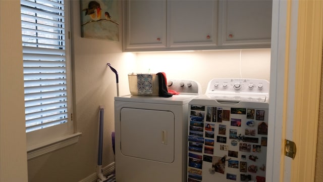 laundry area with cabinet space and washer and dryer