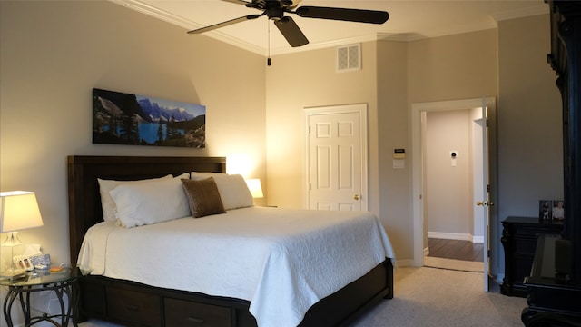 bedroom featuring ceiling fan, baseboards, visible vents, and ornamental molding