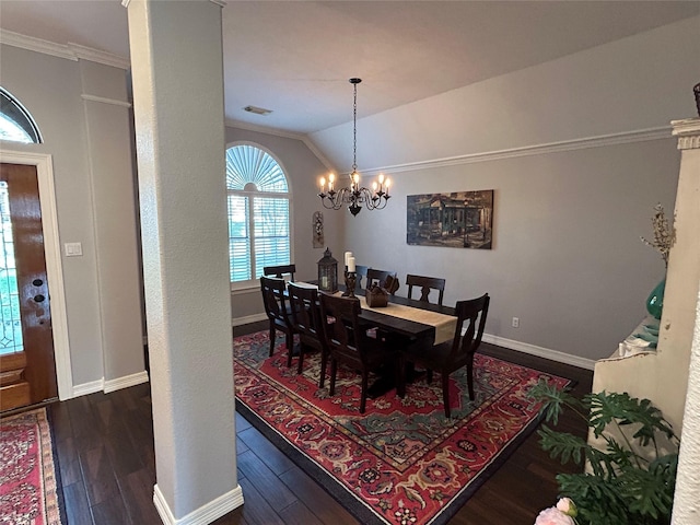 dining area featuring baseboards, wood finished floors, an inviting chandelier, and vaulted ceiling