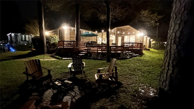 yard at twilight with a deck