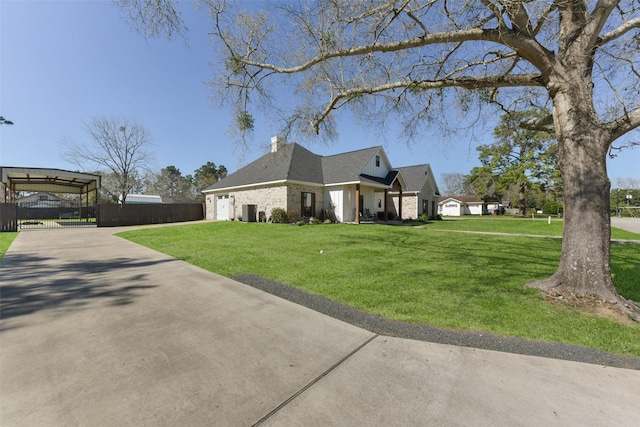 view of home's exterior featuring a lawn, concrete driveway, an attached garage, and fence