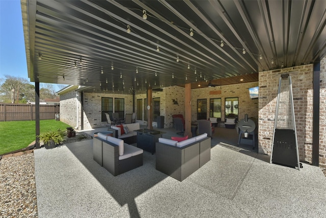 view of patio / terrace with an outdoor hangout area and fence