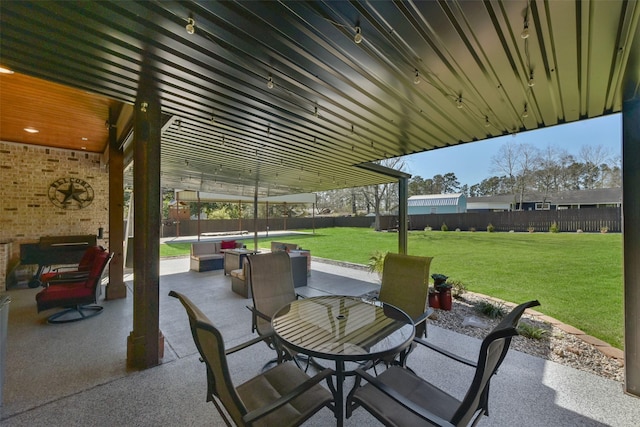 view of patio with outdoor dining area and a fenced backyard