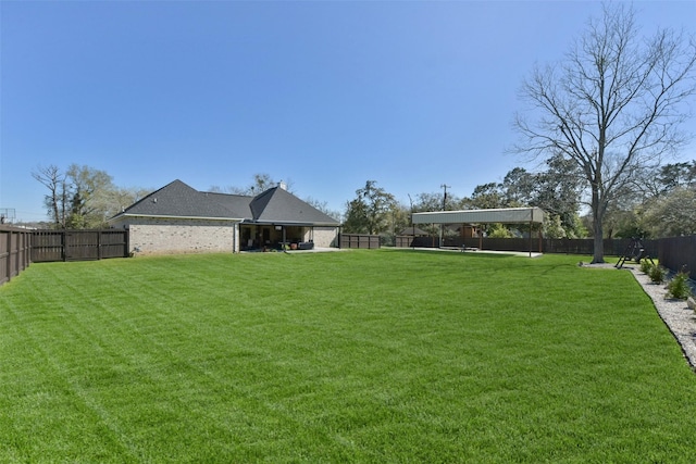 view of yard featuring a fenced backyard