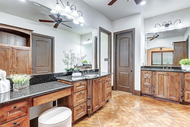 full bathroom featuring tile patterned floors, a ceiling fan, visible vents, and a sink