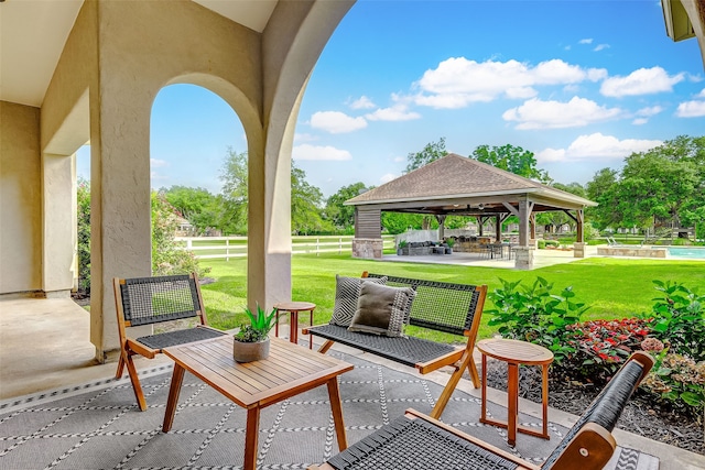 view of patio featuring a gazebo and fence