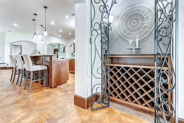 interior space with recessed lighting and arched walkways