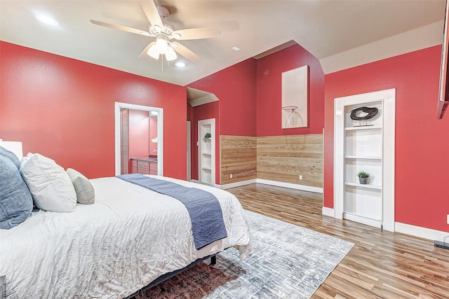 bedroom with a ceiling fan, recessed lighting, wood finished floors, and baseboards