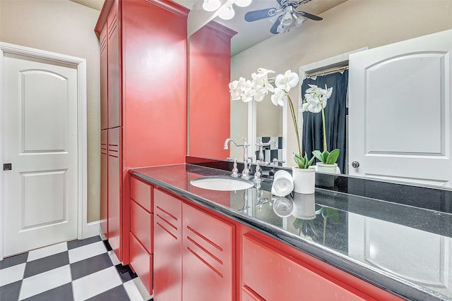 bathroom featuring tile patterned floors, ceiling fan, and vanity