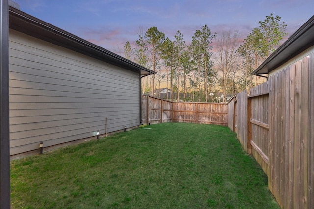 view of yard with a fenced backyard