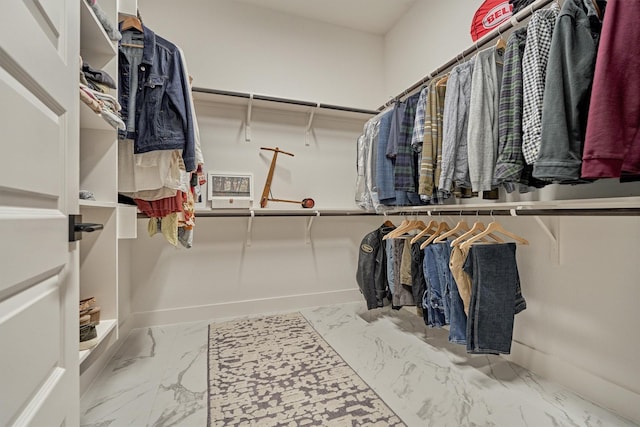 spacious closet with marble finish floor