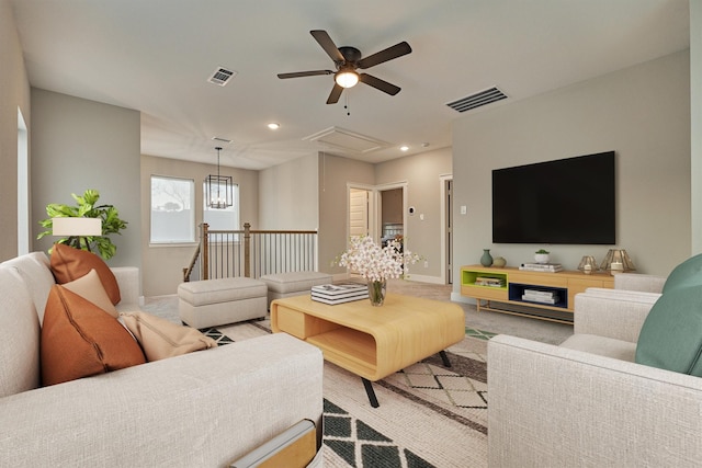 living area featuring recessed lighting, visible vents, baseboards, and attic access