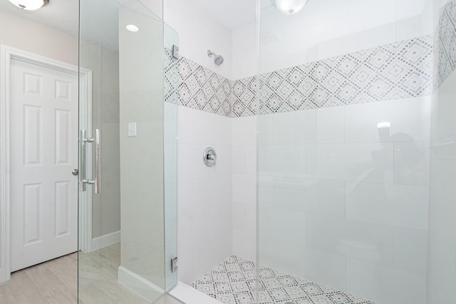 full bathroom with tiled shower