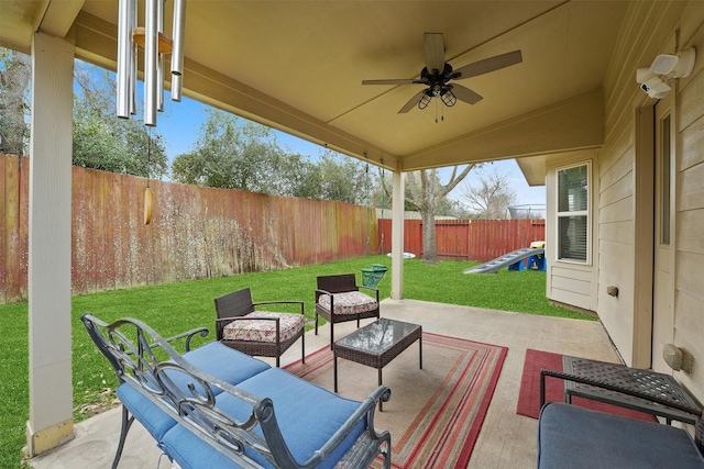 view of patio featuring a ceiling fan, a fenced backyard, and an outdoor hangout area