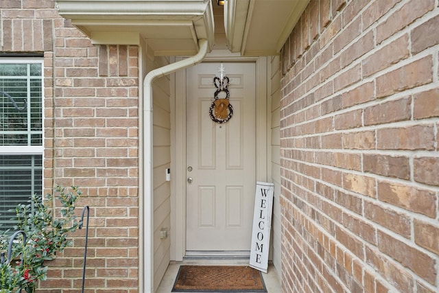 entrance to property with brick siding