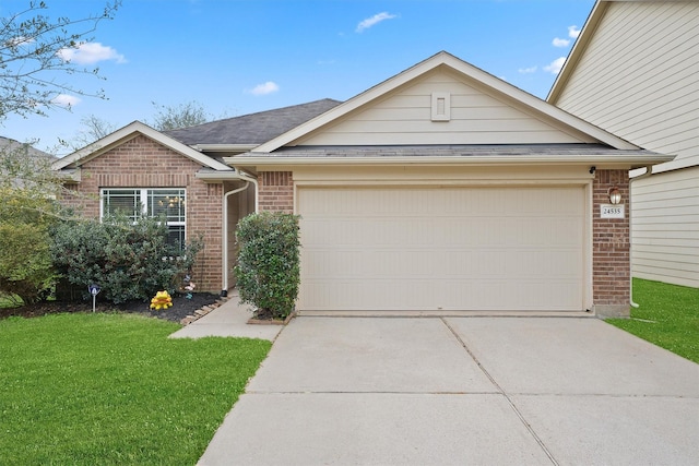 ranch-style house featuring concrete driveway, a garage, brick siding, and a front lawn