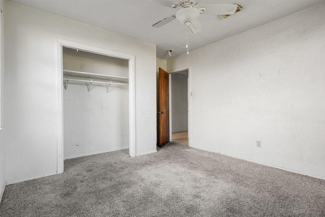 unfurnished bedroom featuring a closet, a ceiling fan, and carpet floors