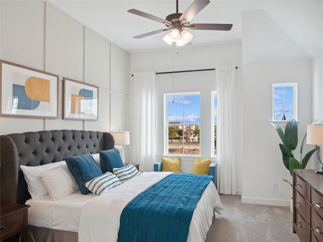 5617 Iris Harvest Dr, Houston, TX 77091 - bedroom with light colored carpet, multiple windows, and a ceiling fan