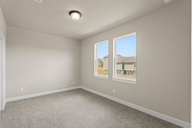 5617 Iris Harvest Dr, Houston, TX 77091 - carpeted spare room with baseboards and a smoke detector