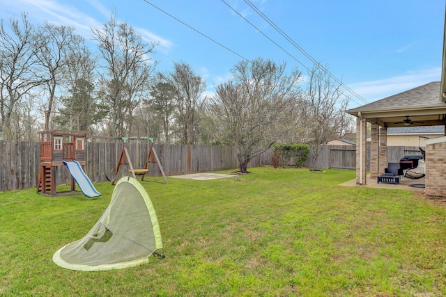 view of yard with a fenced backyard, a playground, and a patio