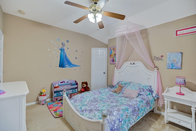 bedroom with light colored carpet, a ceiling fan, baseboards, and vaulted ceiling