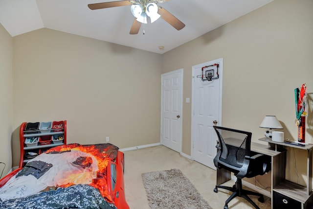 bedroom with light carpet, ceiling fan, baseboards, and vaulted ceiling