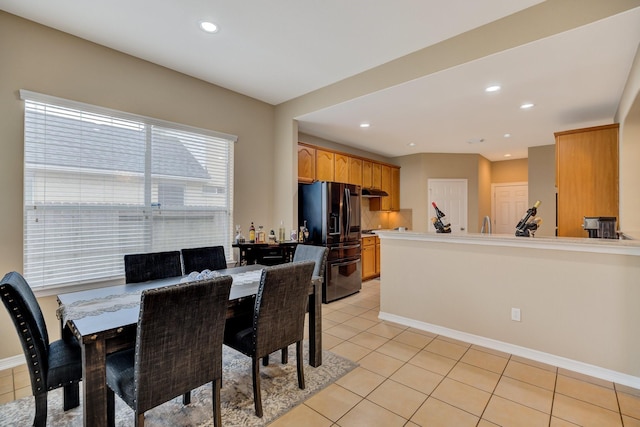 dining space featuring recessed lighting, baseboards, and light tile patterned flooring