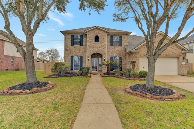 view of front of house with a garage, brick siding, a front lawn, and fence