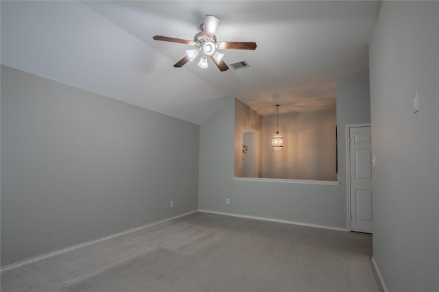 additional living space featuring visible vents, carpet flooring, baseboards, ceiling fan, and vaulted ceiling