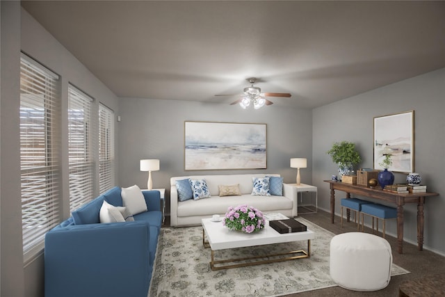 living area with baseboards and ceiling fan