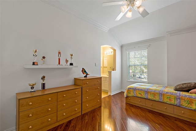 bedroom with arched walkways, ornamental molding, hardwood / wood-style flooring, vaulted ceiling, and connected bathroom