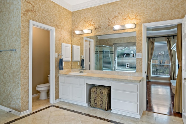 full bath with baseboards, a stall shower, crown molding, and wallpapered walls