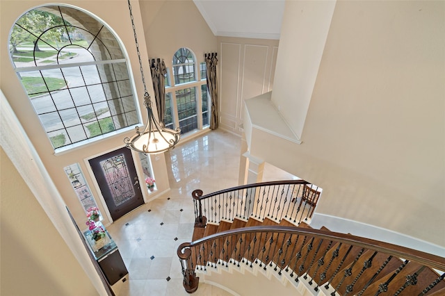 tiled foyer with a decorative wall