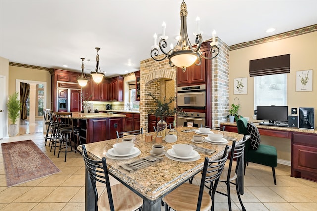 dining room with light tile patterned floors, ornamental molding, and recessed lighting