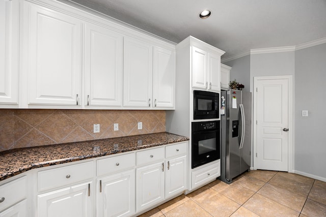 kitchen with dark stone counters, ornamental molding, black appliances, white cabinets, and tasteful backsplash