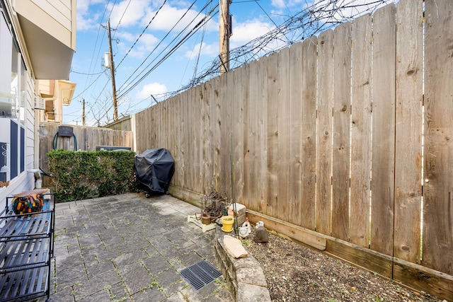 view of patio / terrace featuring grilling area and fence