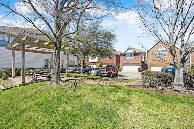 view of yard with a pergola and a residential view