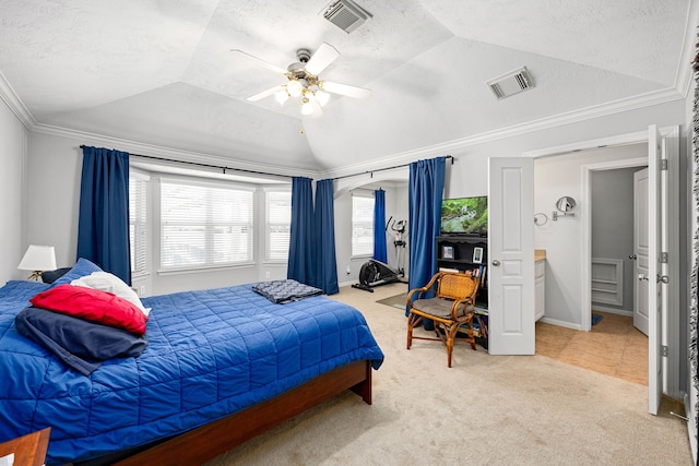 carpeted bedroom featuring lofted ceiling, crown molding, visible vents, and a textured ceiling