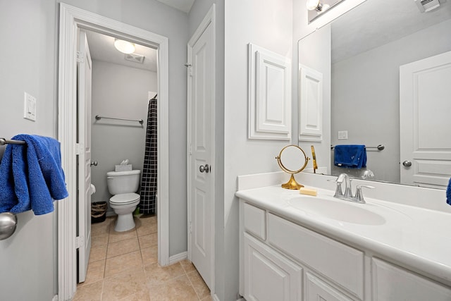 bathroom featuring visible vents, toilet, vanity, and tile patterned flooring