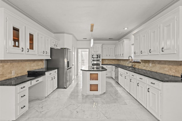 kitchen featuring a sink, appliances with stainless steel finishes, and white cabinets