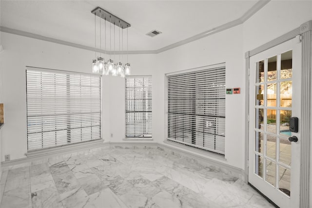 spare room featuring visible vents, marble finish floor, and crown molding