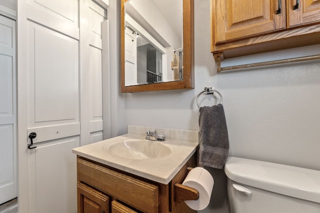 half bath with vanity and toilet