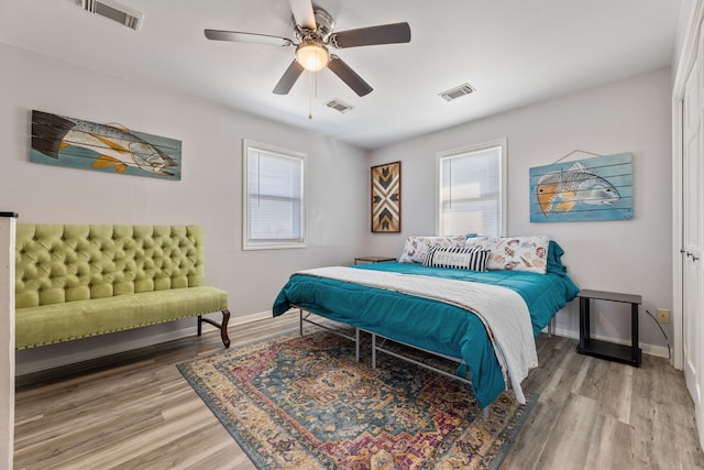 bedroom featuring visible vents and light wood-style flooring