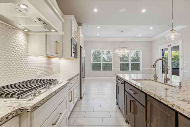 kitchen with dark brown cabinets, crown molding, custom range hood, stainless steel appliances, and a sink