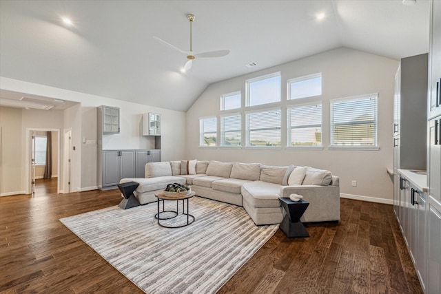 living room featuring vaulted ceiling, baseboards, and dark wood-style flooring